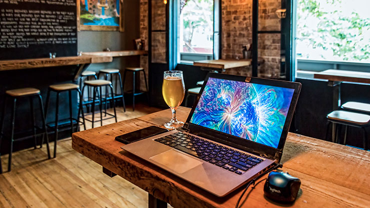 FINISHING UP SOME WORK, CHECKING SOME EMAILS, AT A CHARMING NEIGHBORHOOD BAR SYDNEY / AUSTRALIA